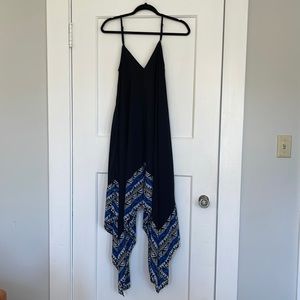 Black spaghetti strap dress with black, white, and blue print.